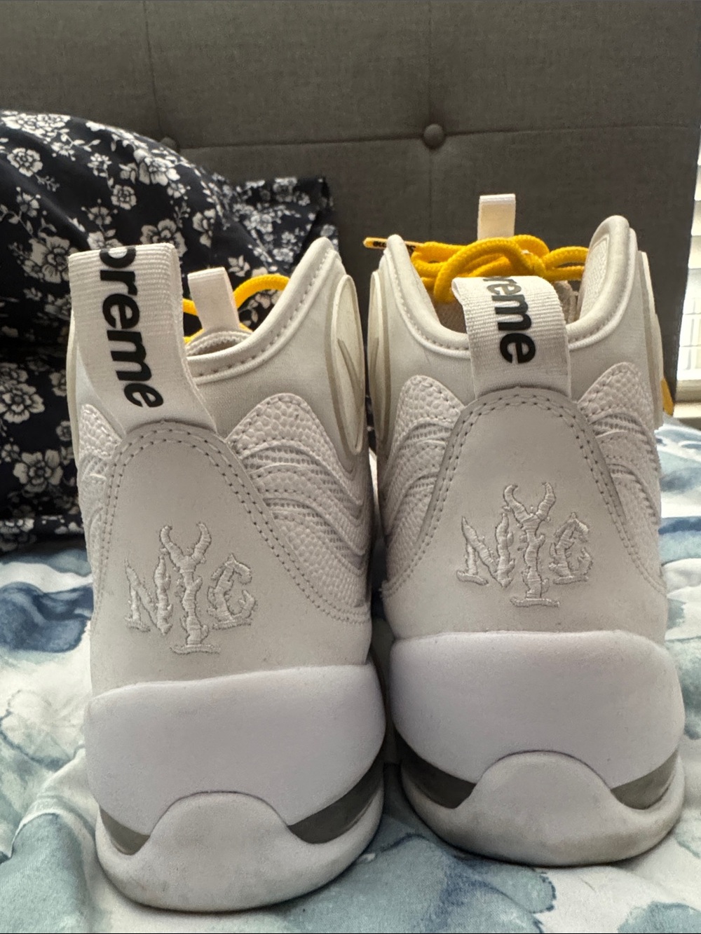 Supreme White Athletic Shoes with Yellow Laces